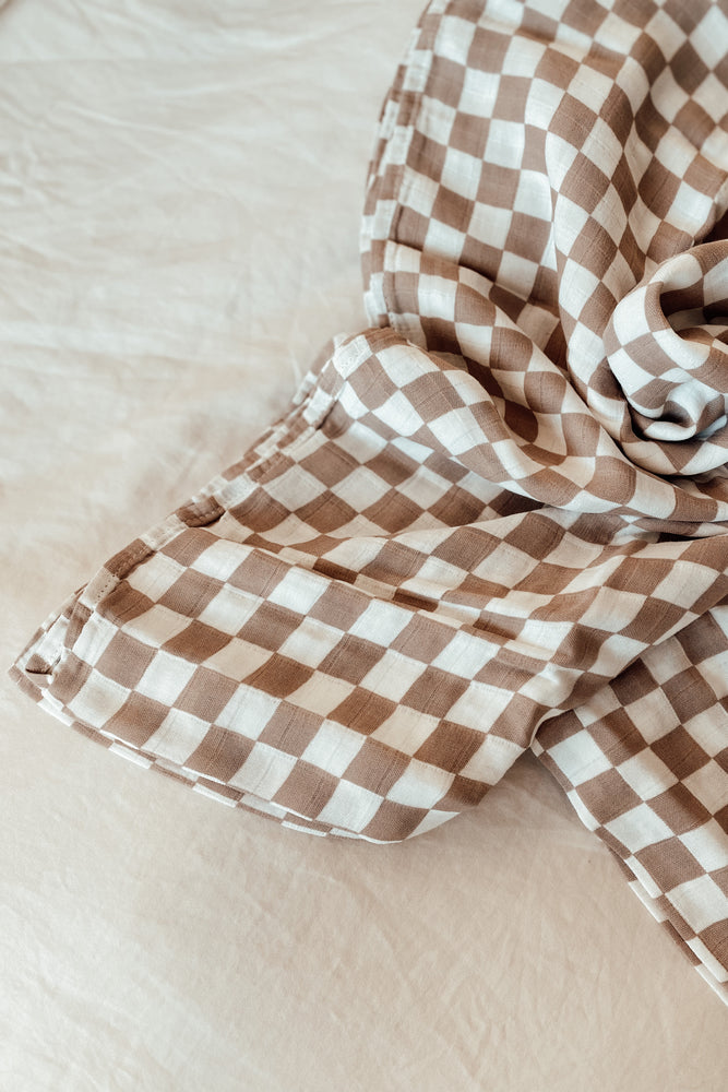 
                
                    Load image into Gallery viewer, Checker Print Muslin Swaddle
                
            